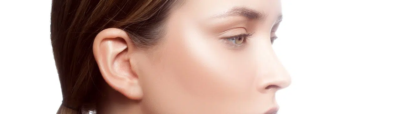 Beauty model girl face close-up, studio headshot, perfect skin